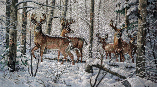 Олени в снежном лесу